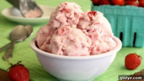 A scoop of Strawberries and Cream Ice Cream