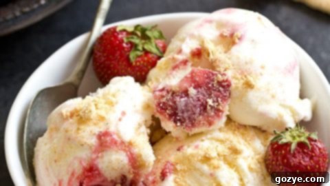 A scoop of Strawberry Cheesecake Ice Cream