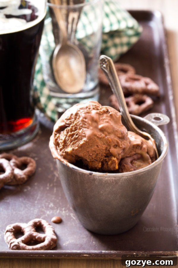 A scoop of Chocolate Stout Pretzel Ice Cream with pretzel pieces