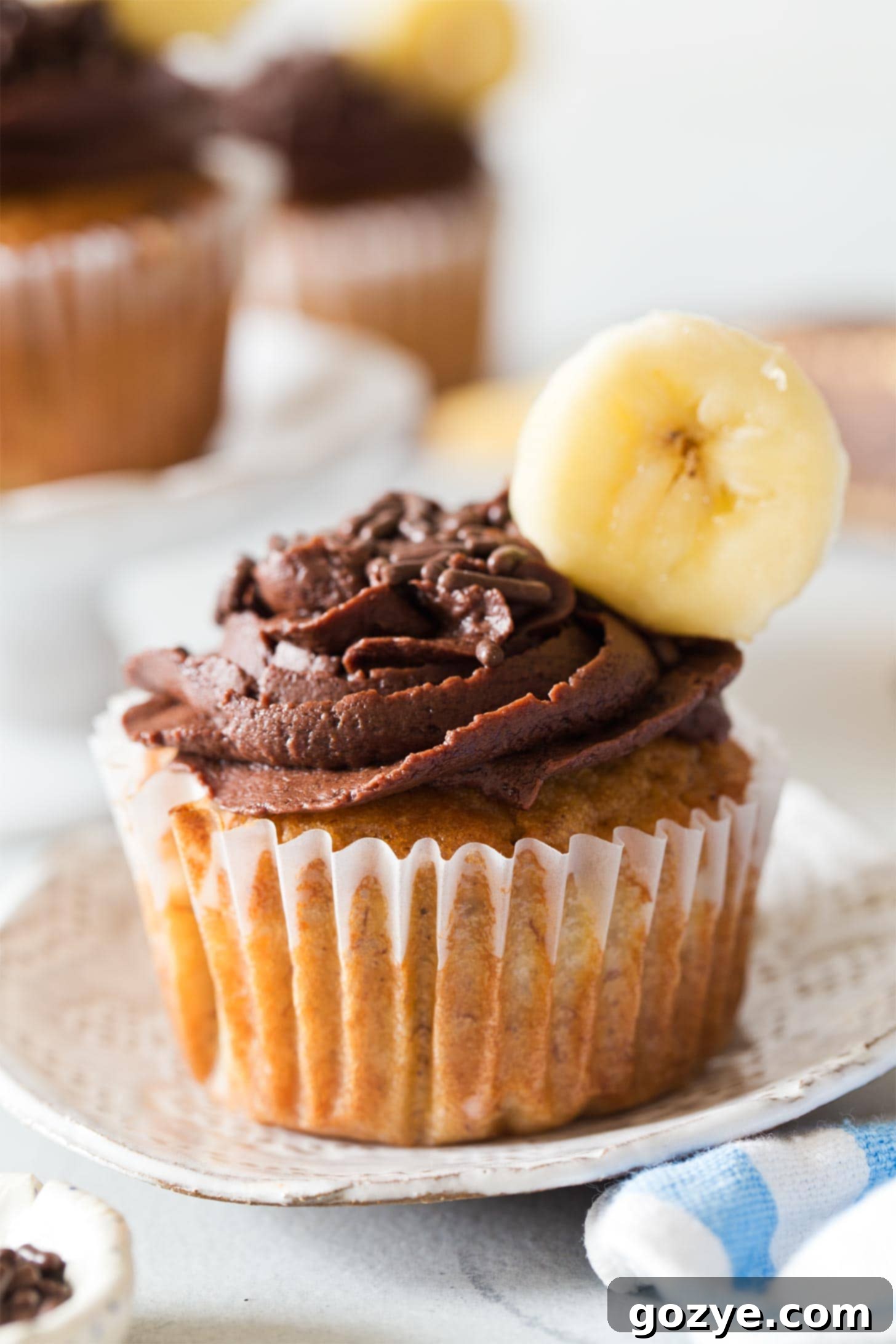 Close up of banana cupcakes on white plate
