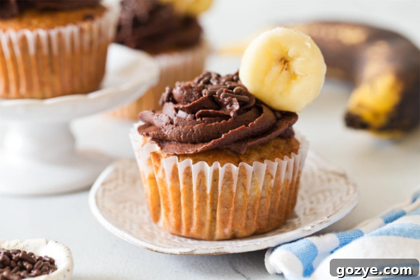 Banana Cupcakes with buttercream frosting on a plate