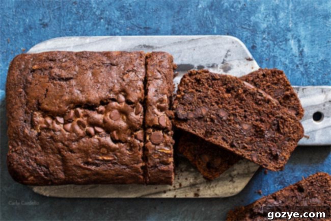 Secret Garden Chocolate Loaf 5 9x5 Chocolate Zucchini Bread made with melted butter, cooling on a rack.