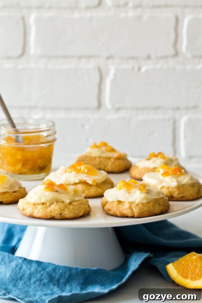 Orange Cookies on white cake stand