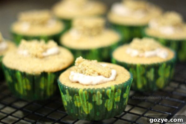 Irish Cream Cupcakes revealing their creamy mousse filling, displayed artfully