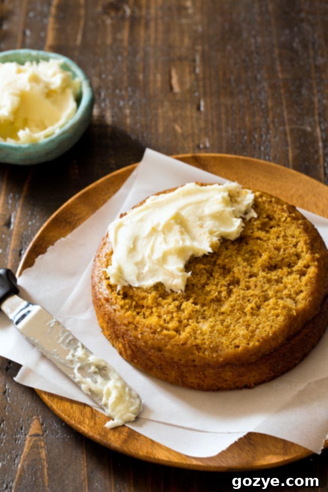 Cream Cheese Frosting on top of Small 6 Inch Pumpkin Cake