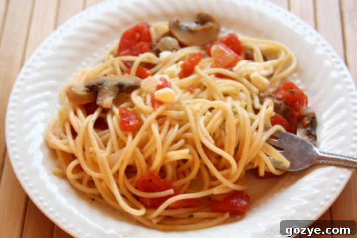 Easy Olive Oil Pasta 3 Close-up of cooked pasta noodles tossed in olive oil with garlic and herbs
