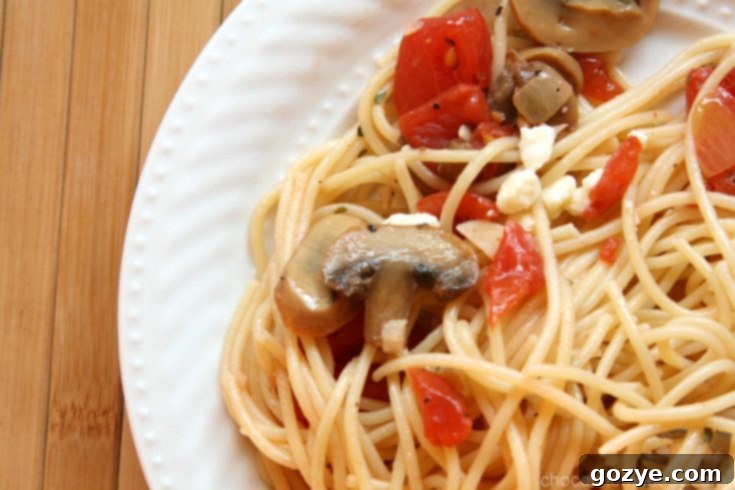 Simple Olive Oil Pasta on a plate with feta