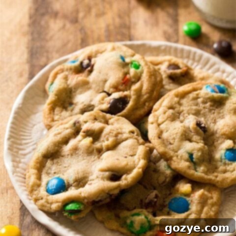 Soft and chewy Small Batch M&M Cookies, garnished with extra M&Ms.