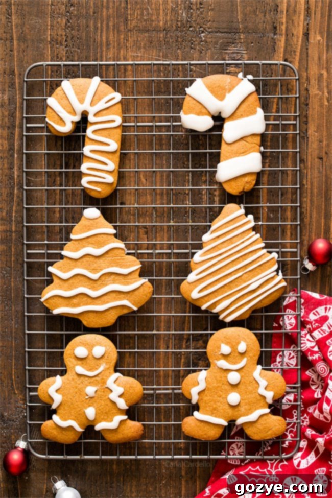 Small batch gingerbread cookies cooling on a rack, ready for eggless royal icing decoration