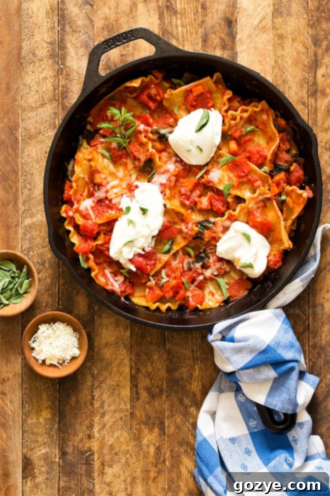 Skillet Lasagna assembled in cast iron pan, ready to be served