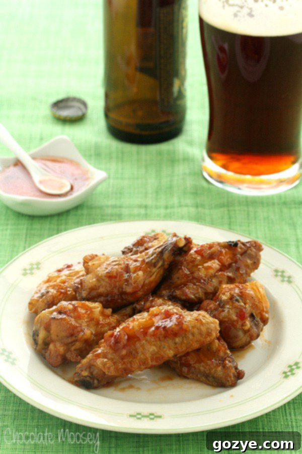 Plate of sweet chili wings on green tablecloth