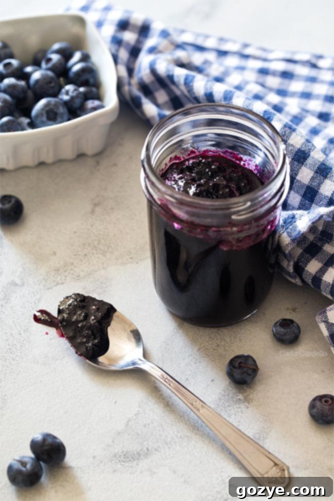 Homemade Blueberry Jam No Pectin Needed 2 Jar of blueberry jam with spoon
