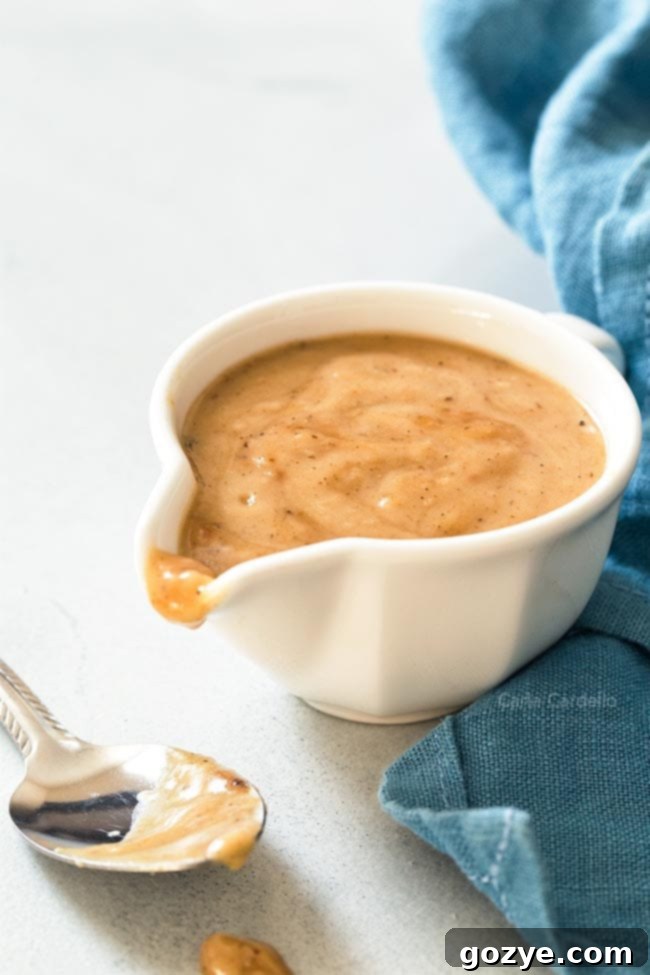 Gravy from drippings in white gravy bowl