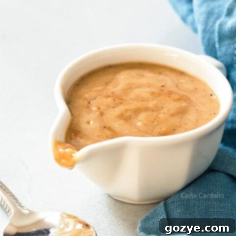 Gravy from drippings in white gravy bowl
