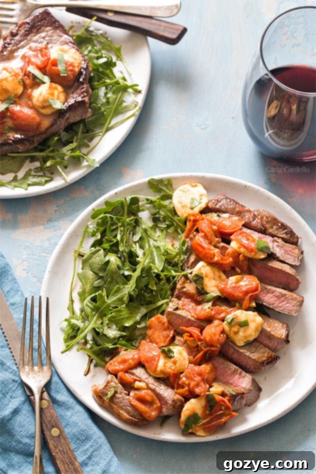 Sliced steak on plate with salad