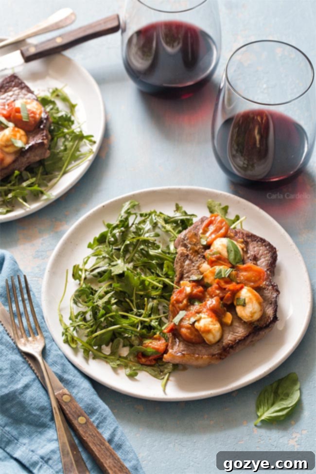 Steak dinner with salad and red wine