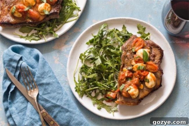 Steak dinner on plate with arugula salad