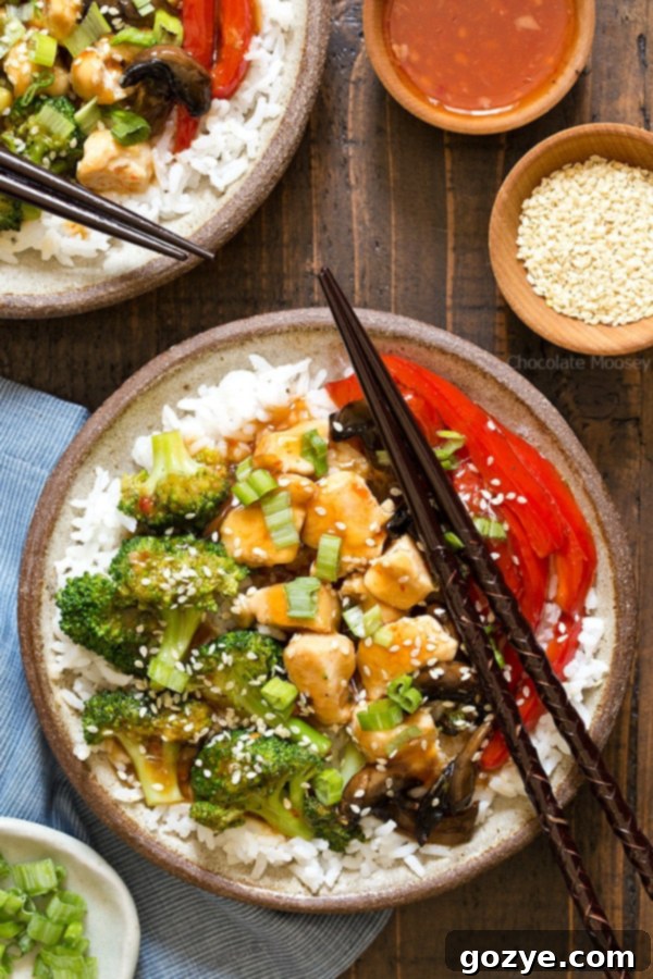 General Tso’s Chicken Rice Bowls with broccoli, red bell pepper, and mushrooms