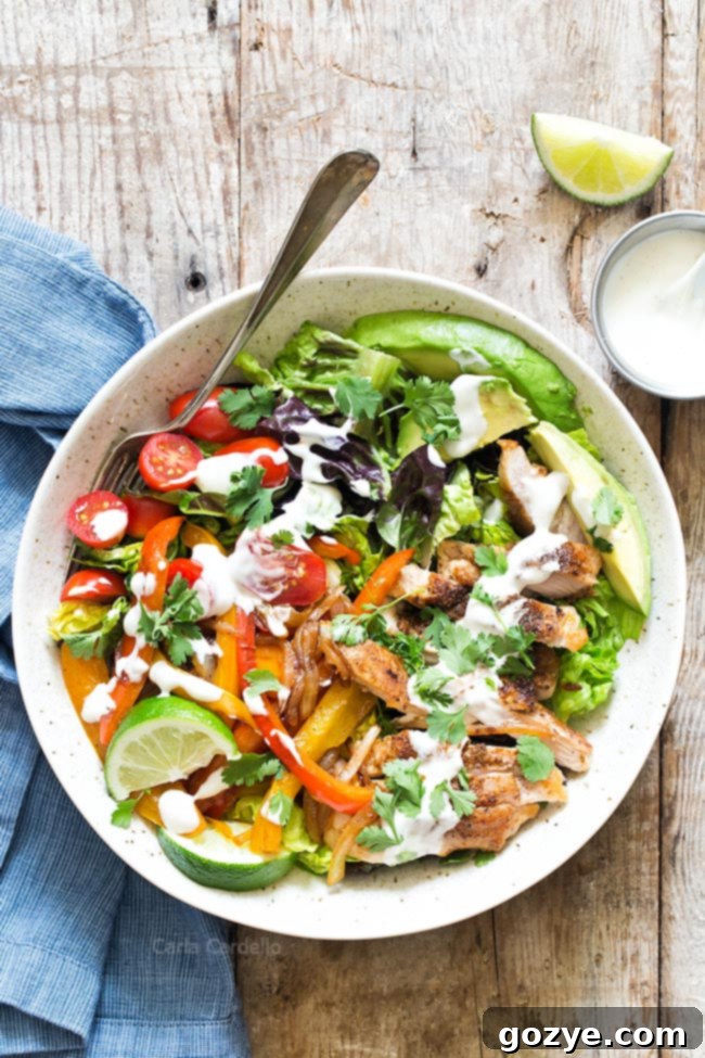 Chicken Fajita Salad with juicy chicken, onion, and bell pepper