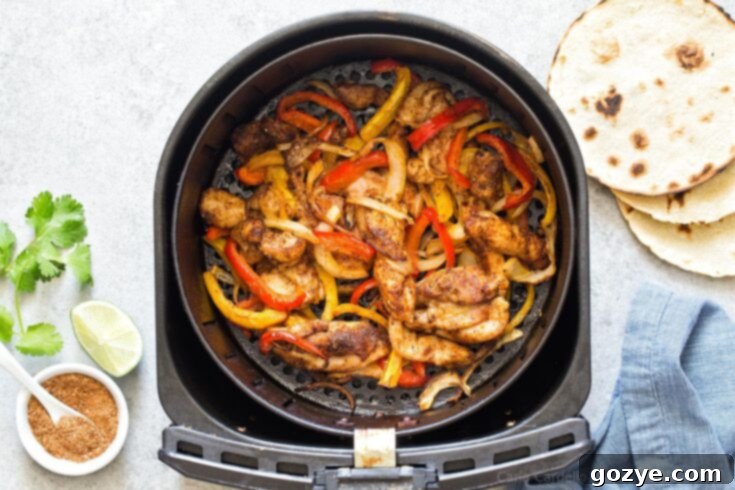Air Fryer Chicken Fajitas with fajita seasoning, bell pepper, and onion