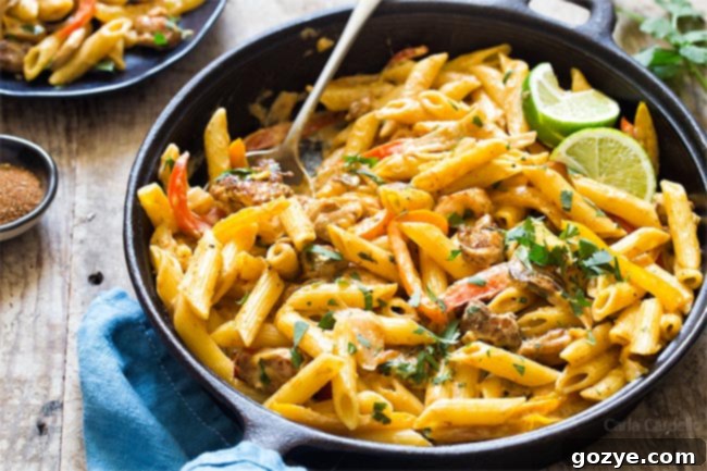Chicken Fajita Pasta with onion, bell peppers, and creamy cheese sauce