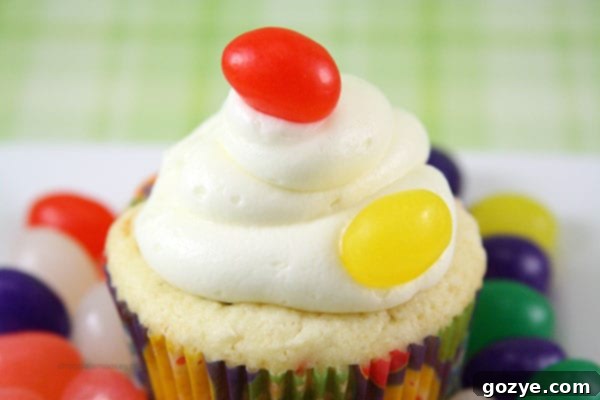 Jelly Bean Cupcakes topped with creamy cream cheese frosting and a jelly bean garnish