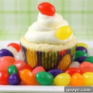 Jelly Bean Cupcakes with Cream Cheese Frosting garnished with extra jelly beans