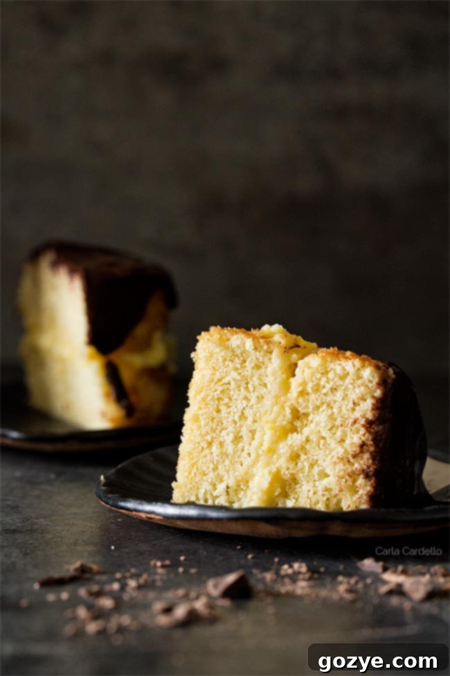 Slice of Mini Boston Cream Pie For Two showing custard and cake layers