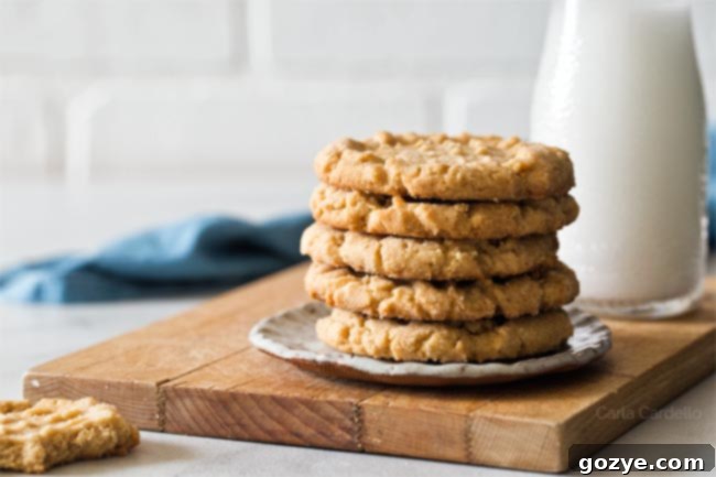 Peanut butter cookies on a plate on a cutting board