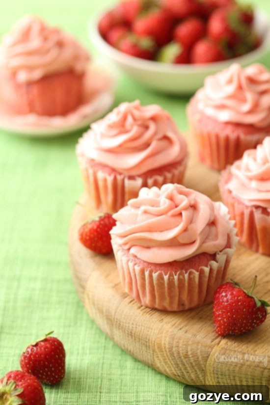 Homemade Strawberry Cupcakes topped with creamy strawberry cream cheese frosting, requiring two egg whites for a small batch.