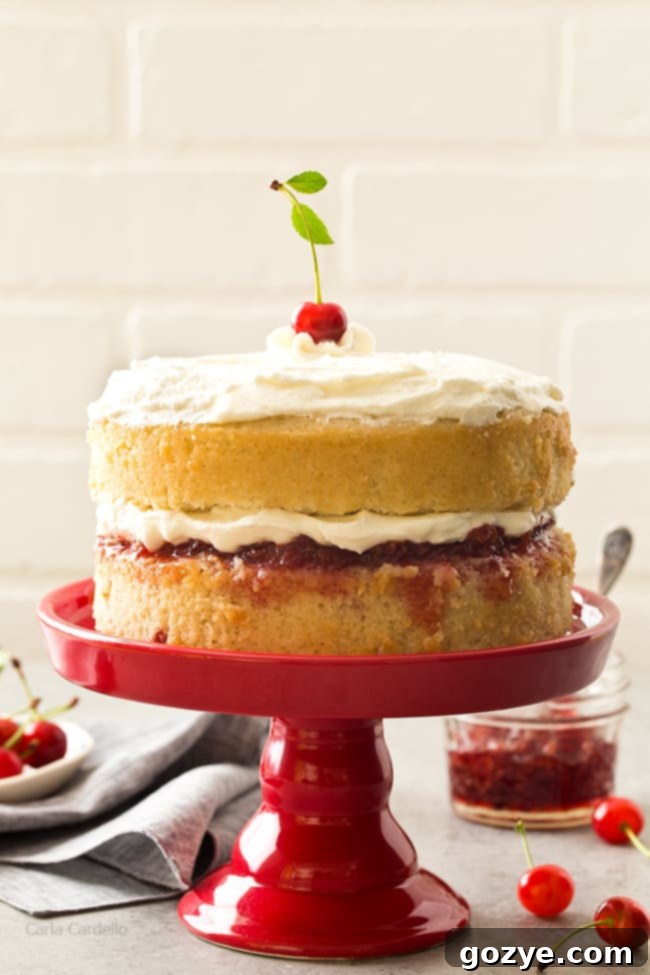 Elegant two-layer Cherry Vanilla Cake with a delicious cherry filling, a great way to use four egg whites.