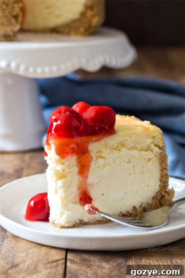 Close up of a slice of Small Cheesecake For Two, showing creamy texture and graham cracker crust.