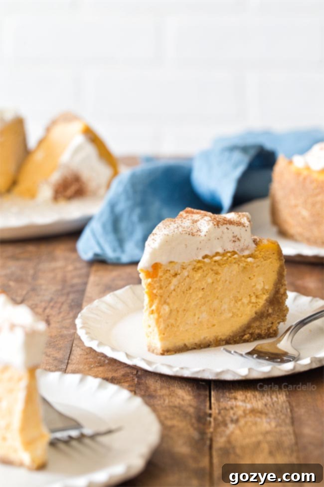 Slice of a perfectly baked 6 Inch Pumpkin Cheesecake recipe, showing creamy texture