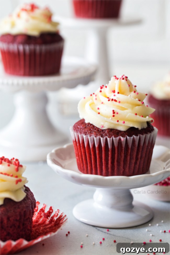 Six Red Velvet Cupcakes arranged on mini cupcake stands