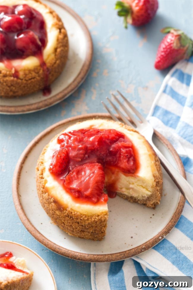 Two perfectly baked 4-inch cheesecakes, ready for garnishing, a delightful dessert for two.
