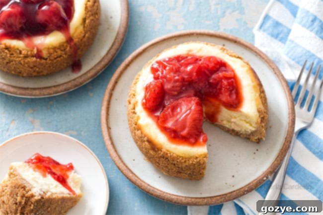A slice of 4-inch cheesecake, showing its creamy texture and graham cracker crust, ready to be enjoyed.
