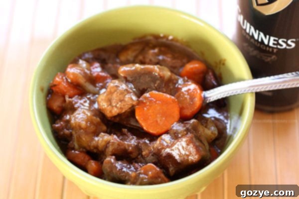 Rich and savory Guinness Beef Stew simmering on the stovetop