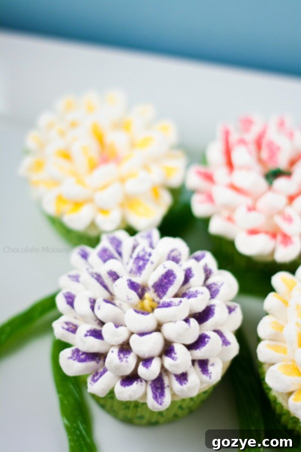 Easy Small Batch Lemon Cupcakes 7 Beautifully decorated flower cupcakes using mini marshmallows and sprinkles, resembling a vibrant bouquet, perfect for a special occasion.