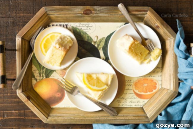 Slices of lemon cake on a rustic wooden tray