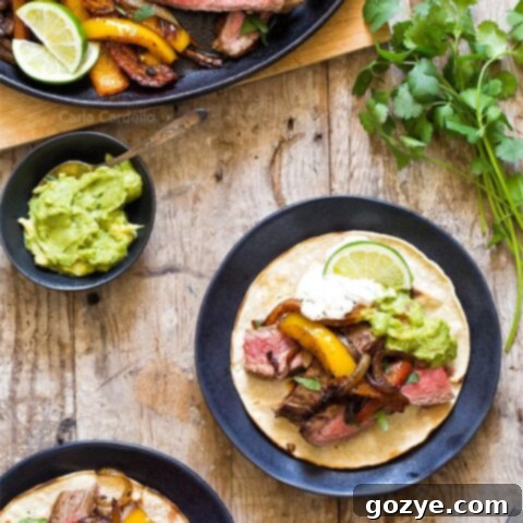 Steak Fajitas for two served in warm tortillas with fresh toppings