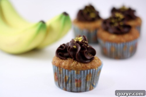 Delicious Banana Cupcakes topped with smooth chocolate buttercream