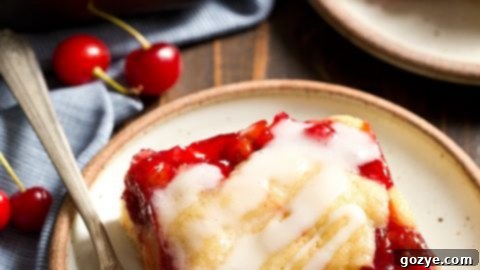 Cherry Cobbler Bars with a crumbly top and icing