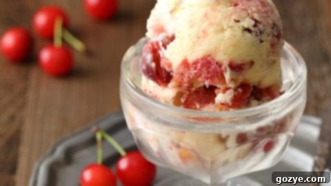 Scoops of Cherry Pie Ice Cream with cherry pieces