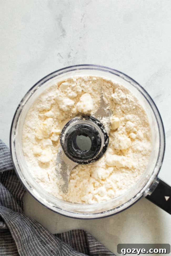 Cold butter and shortening cut into small pieces, added to the flour mixture in a food processor