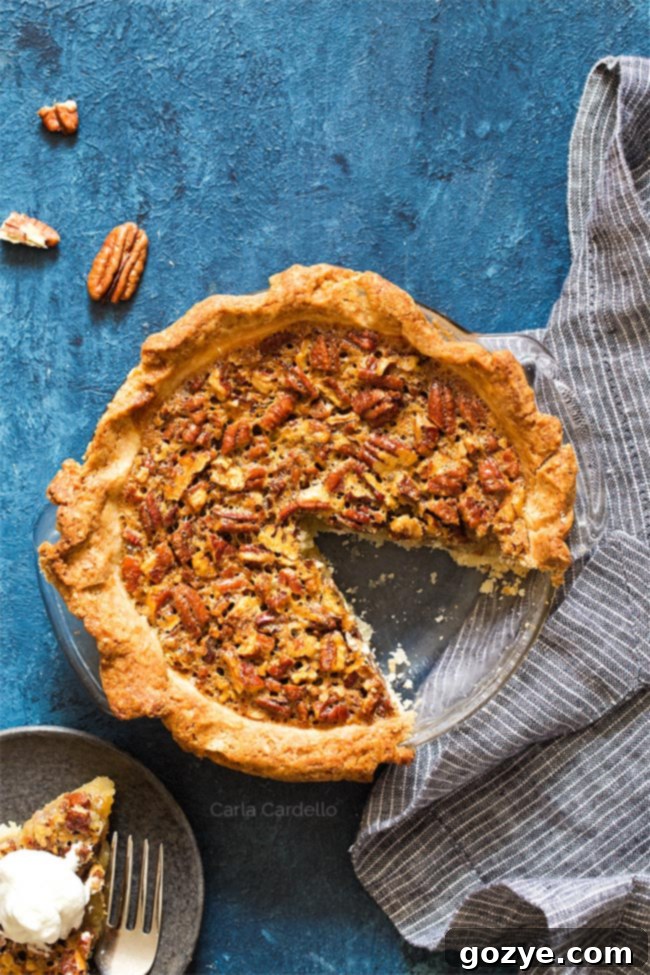 Overhead shot of pecan pie with slice missing