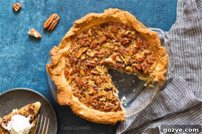 Overhead shot of pecan pie with slice missing