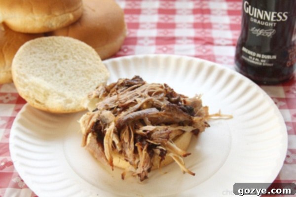 Finished Guinness Pulled Pork Sandwiches plated with a side
