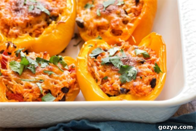 Close up of stuffed peppers for two in white baking dish