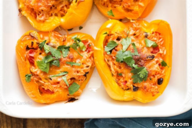 Close up of meatless stuffed peppers in white baking dish