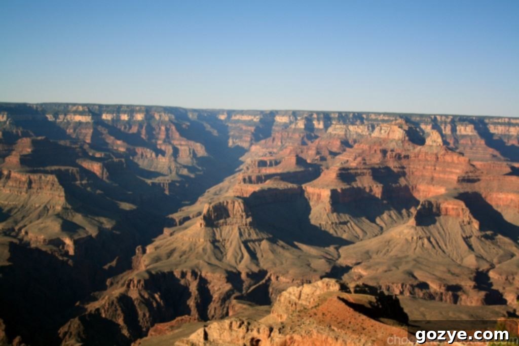 IMG_3522 Another expansive view of the Grand Canyon's rugged landscape under a clear sky.